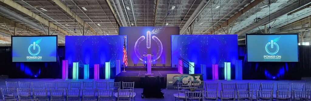A stage lit in blue with two 