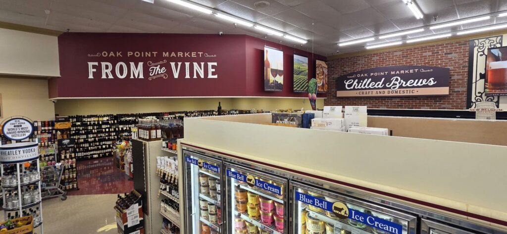 A grocery store area displays signs 
