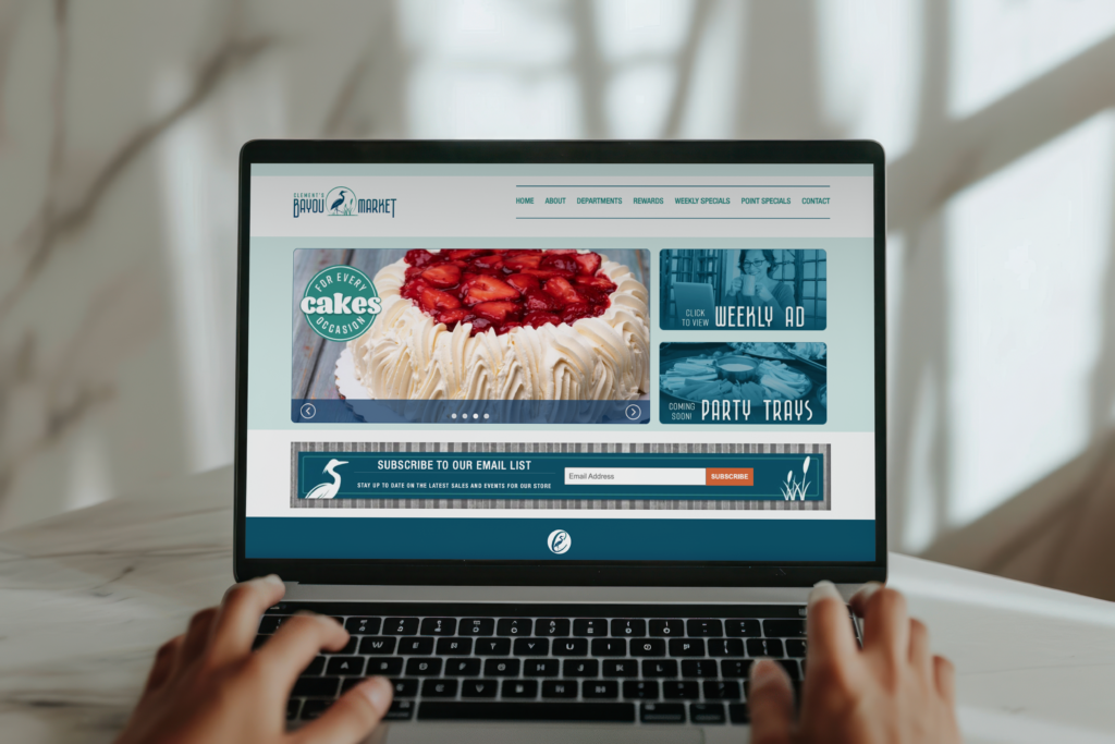 A person browses a bakery website on a laptop, exploring cakes and digital marketing features like weekly ads and party trays.
